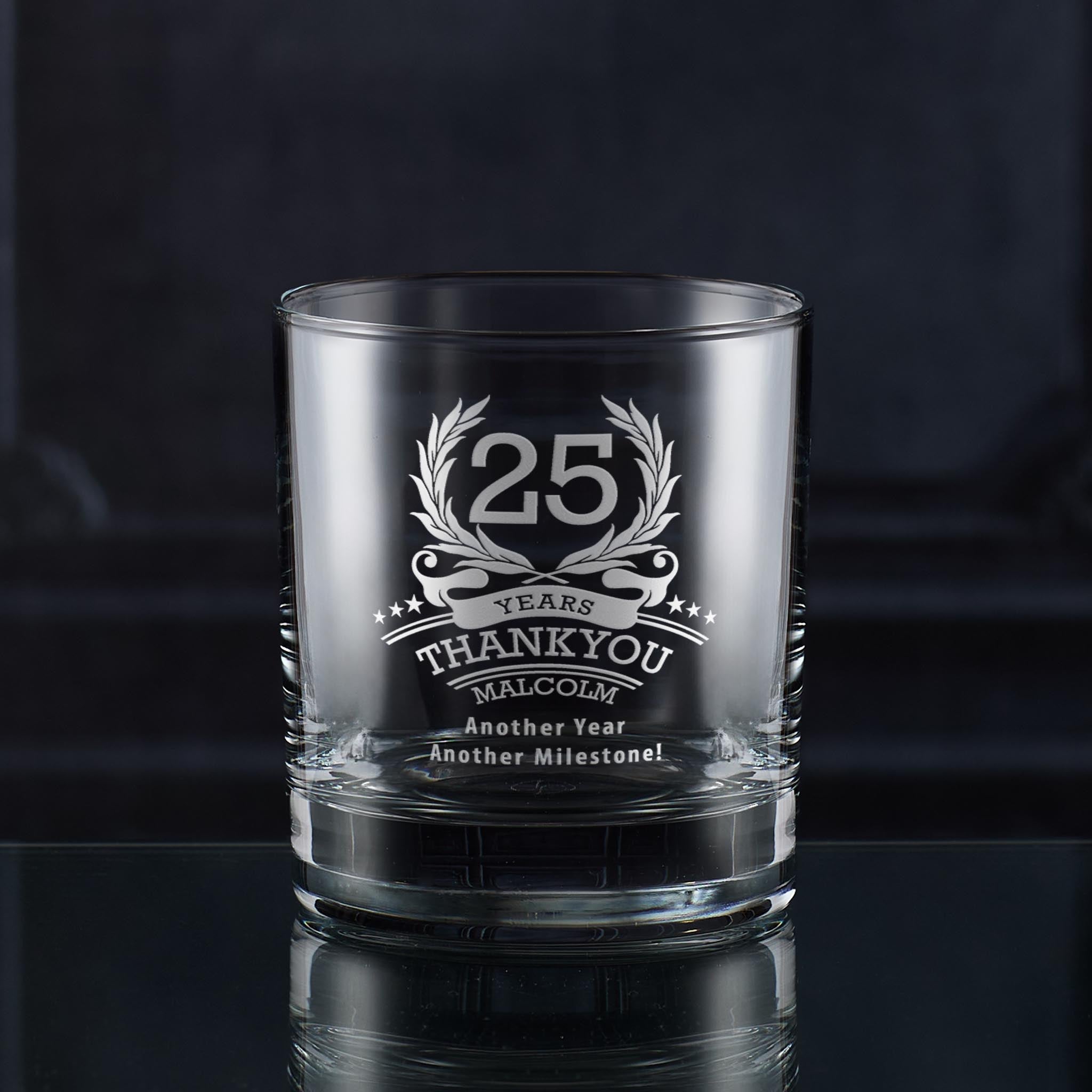 Engraved whisky glass with ‘25’ inside laurel wreath, six stars, and curved name and message