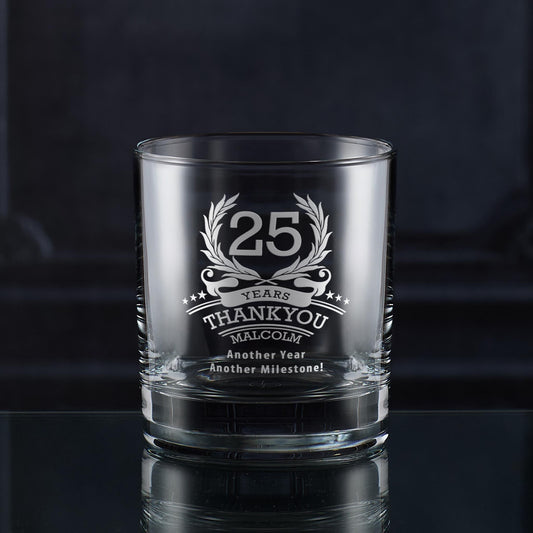 Engraved whisky glass with ‘25’ inside laurel wreath, six stars, and curved name and message