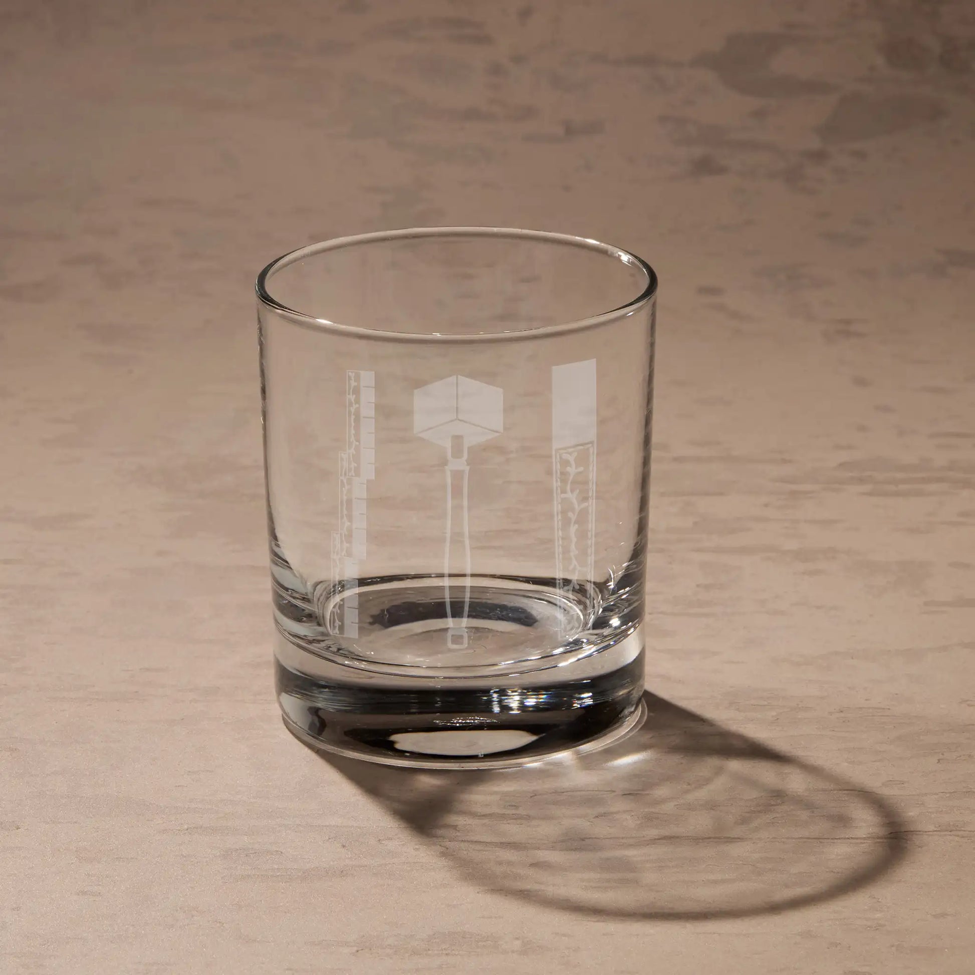 Whisky glass engraved with the eMasonic 1st degree working tools - 24-inch Gauge, the common Gavel, and Chisel.