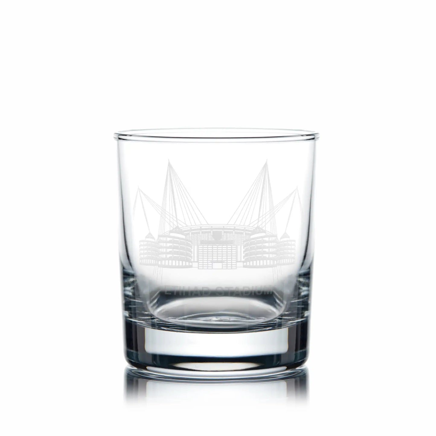 Whisky glass with engraved Etihad Stadium artwork and space for personalisation, photographed on a white background.