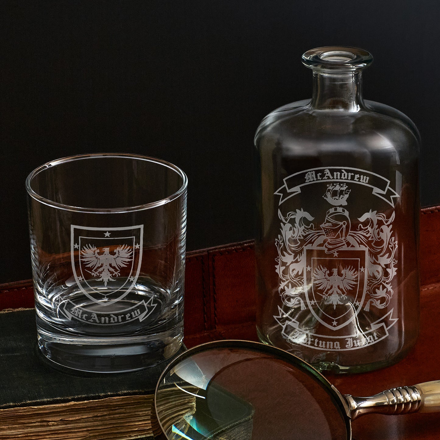 family crest and coat of arms engraved apothecary bottle and whisky glass