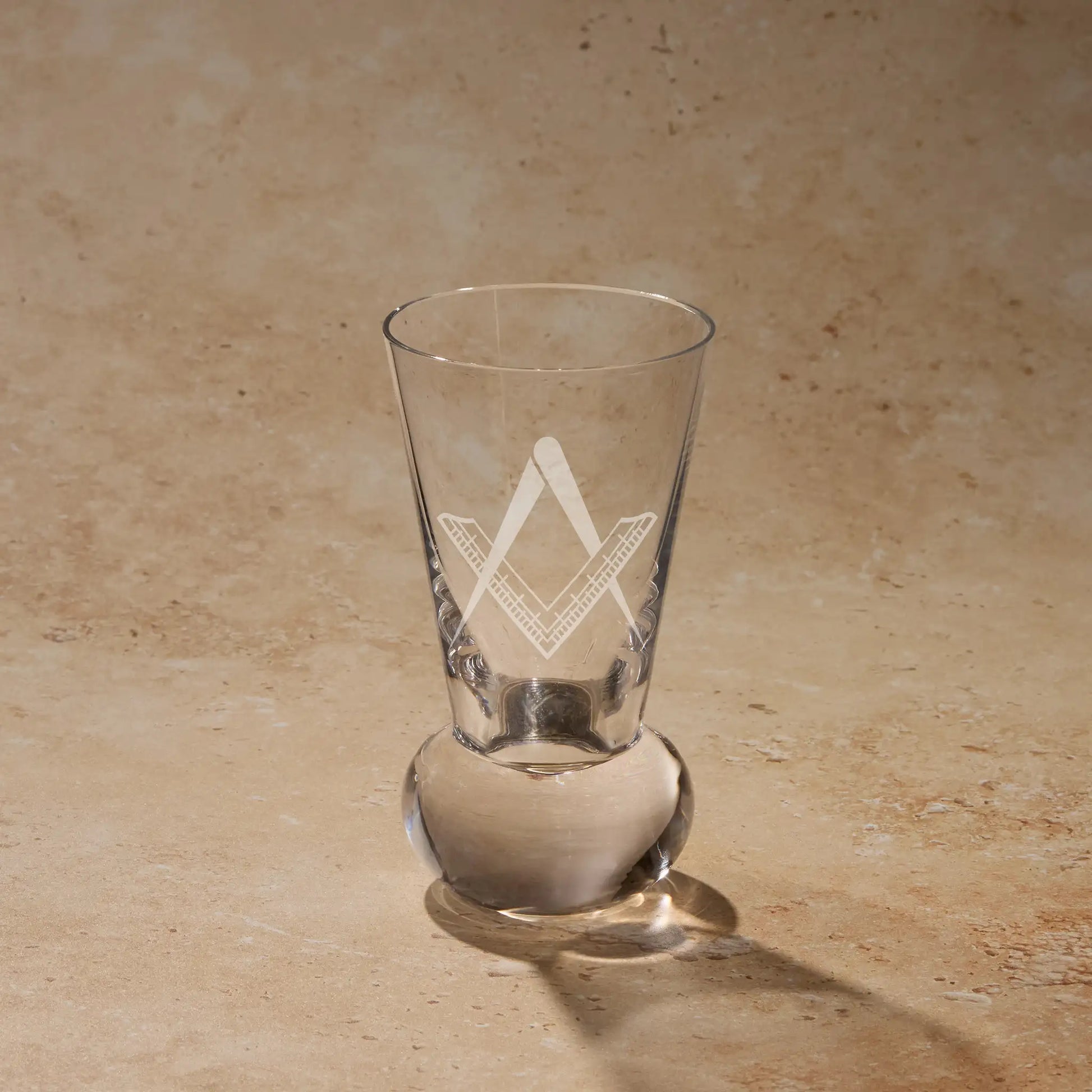 Fellowcraft Second Degree square and compass engraved on firing glass using traditional sandblasting.