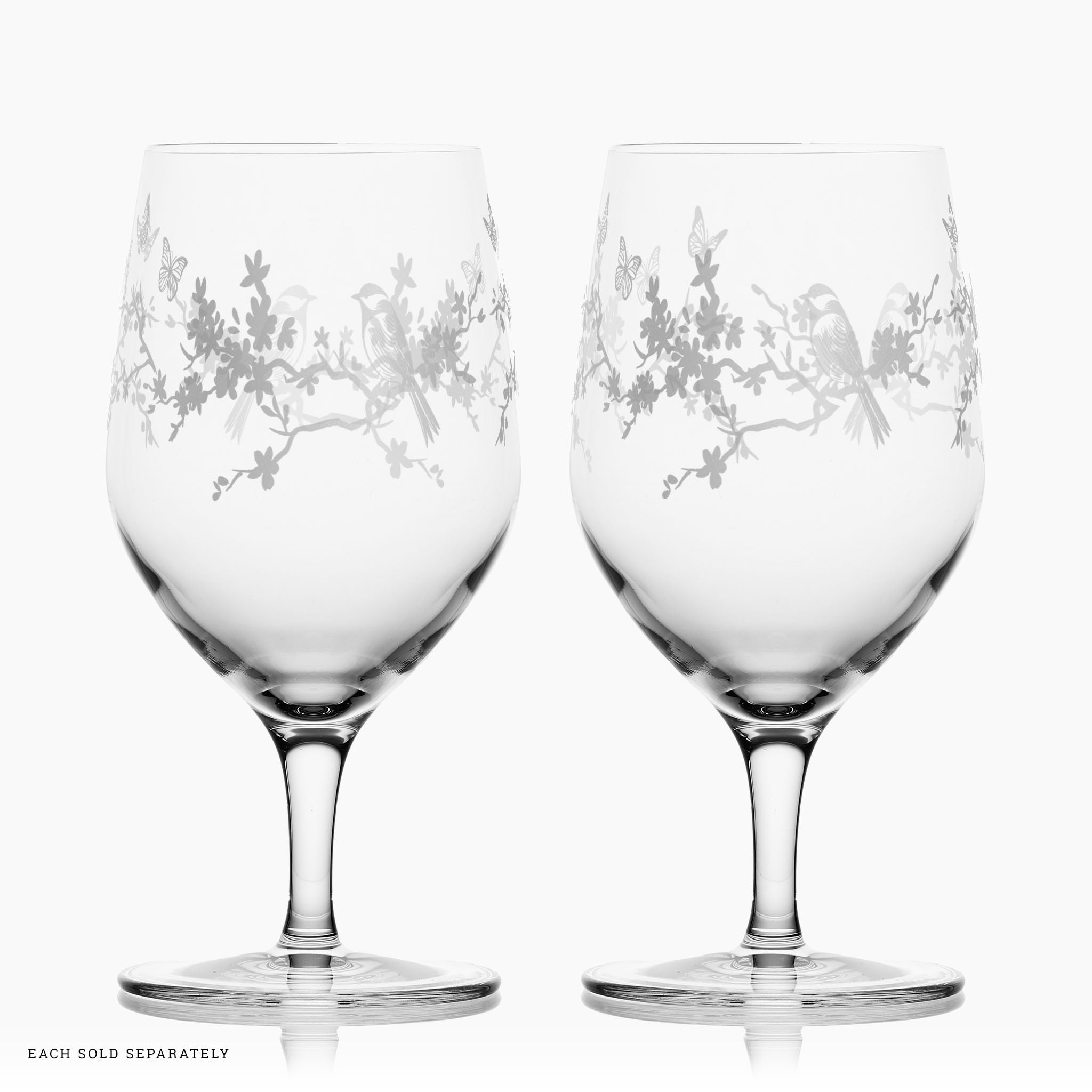 Etched Le Jardin water glasses styled on garden table – elegant glassware for entertaining