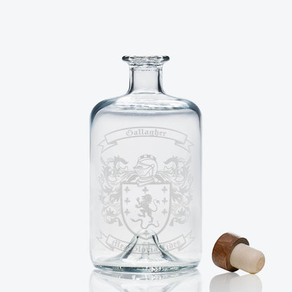 Vintage apothecary bottle decanter engraved with the Gallagher family crest — shield, motto and mantling in satin etch.