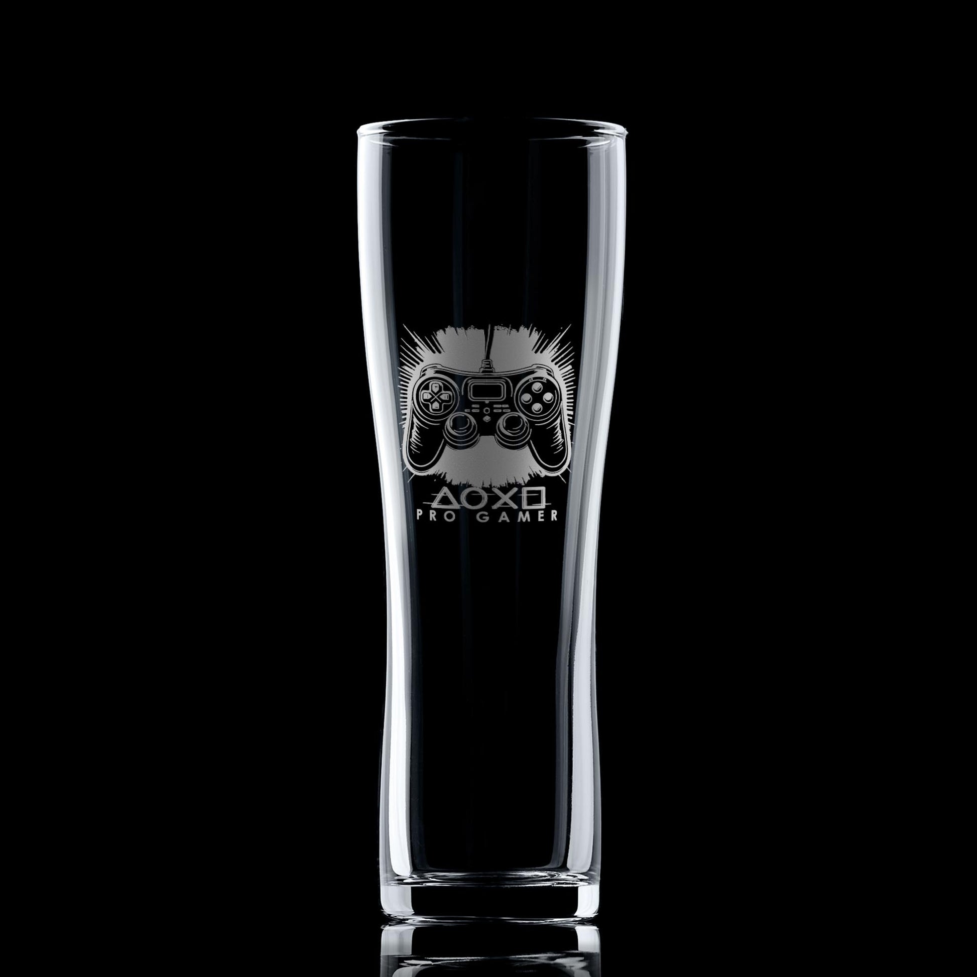 Engraved gamer pint glass featuring a controller design, shown on a black background to highlight engraving detail.