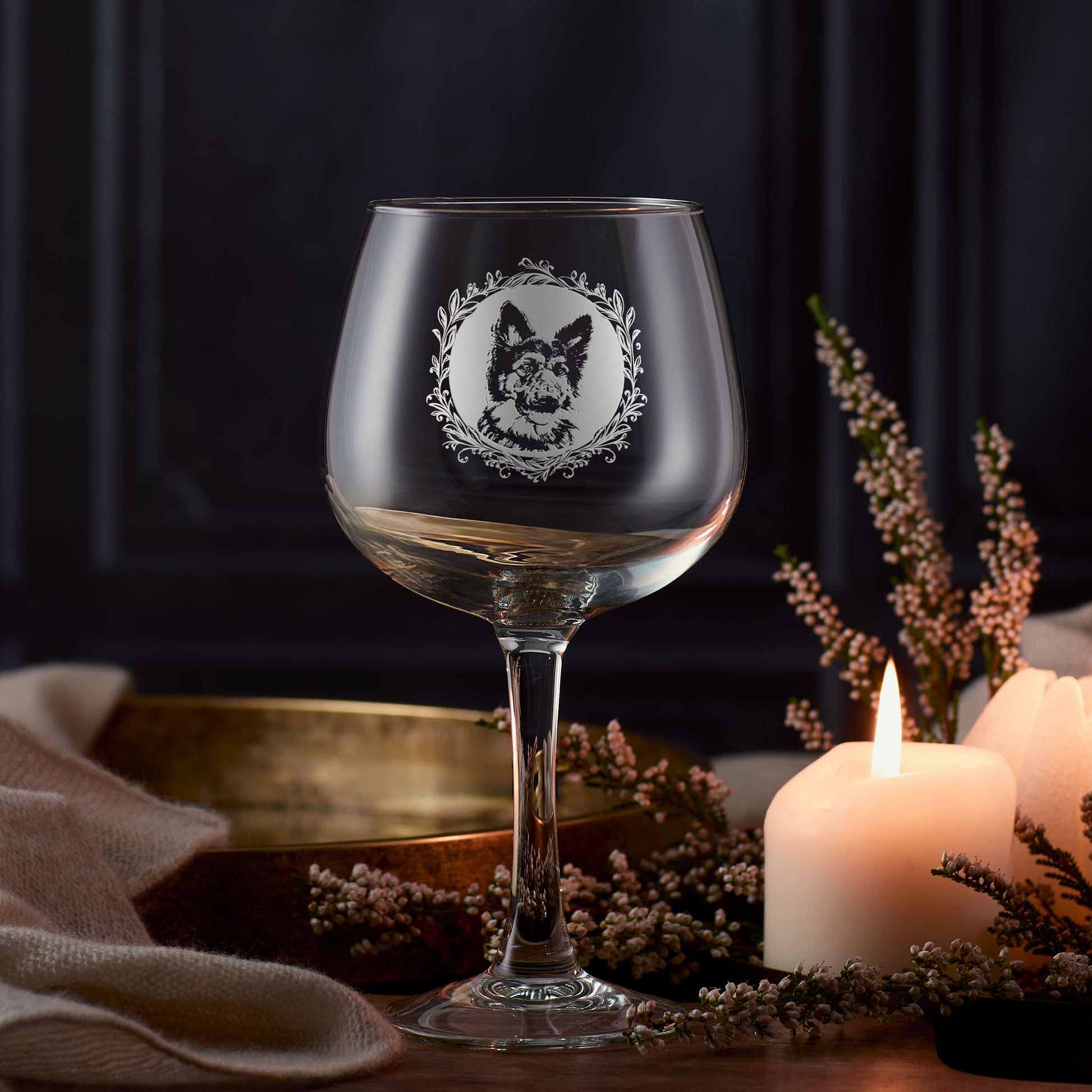 Engraved German Shepherd gin glass featuring a circular portrait surrounded by a leafy garland, created in Scotland.