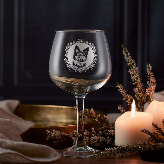 Engraved German Shepherd gin glass featuring a circular portrait surrounded by a leafy garland, created in Scotland.