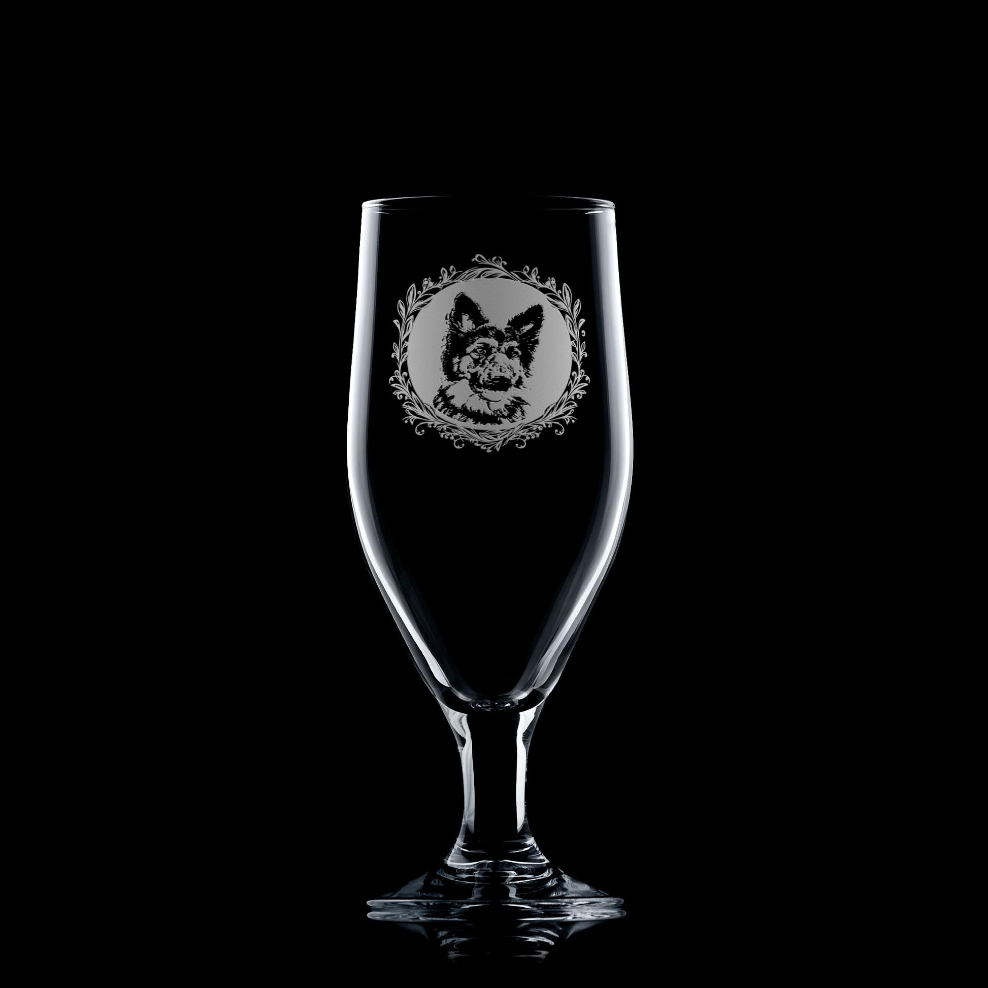 Engraved German Shepherd stemmed beer glass showing a portrait framed by a leafy garland.