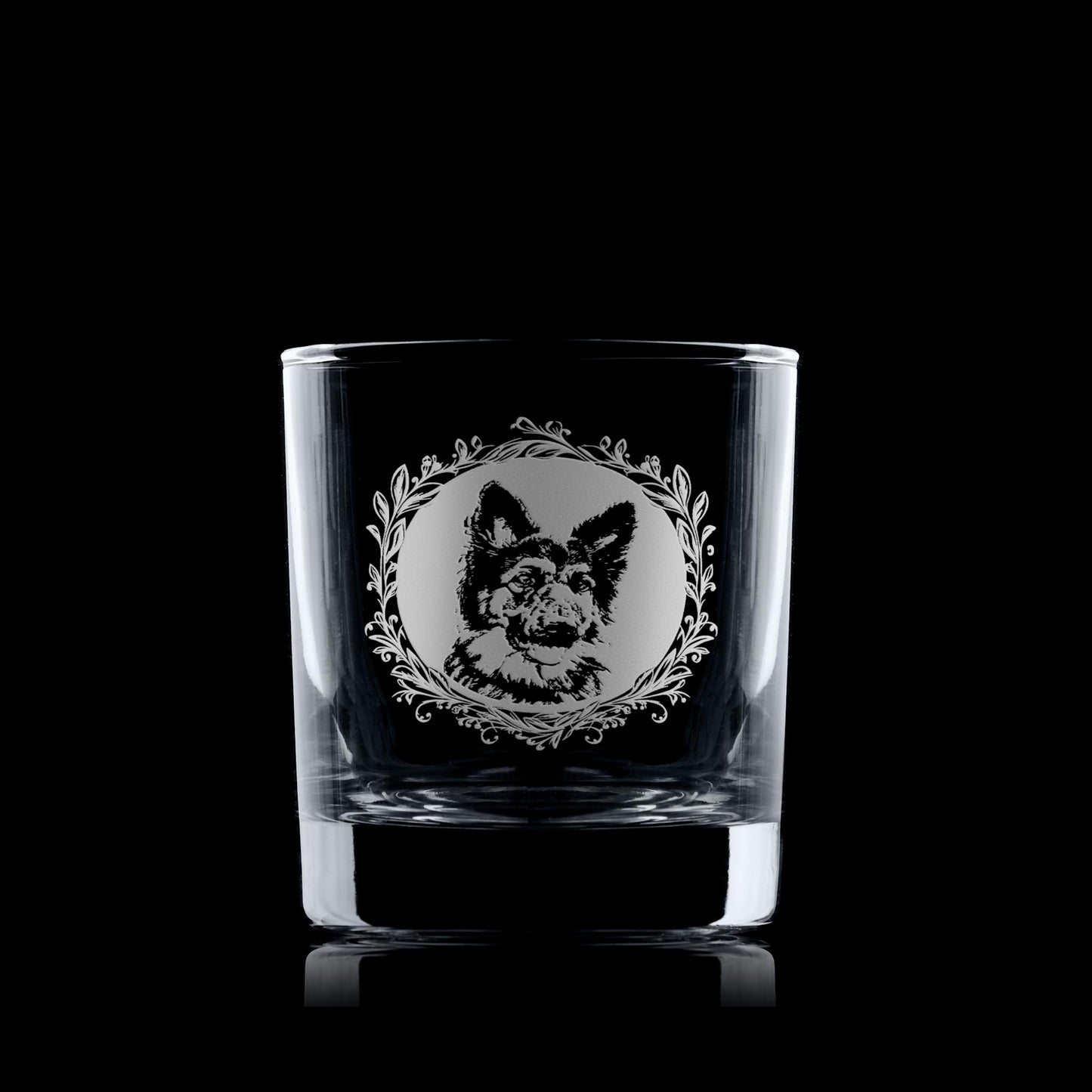 German Shepherd whisky glass displayed on a dark background with a leafy garland portrait design.
