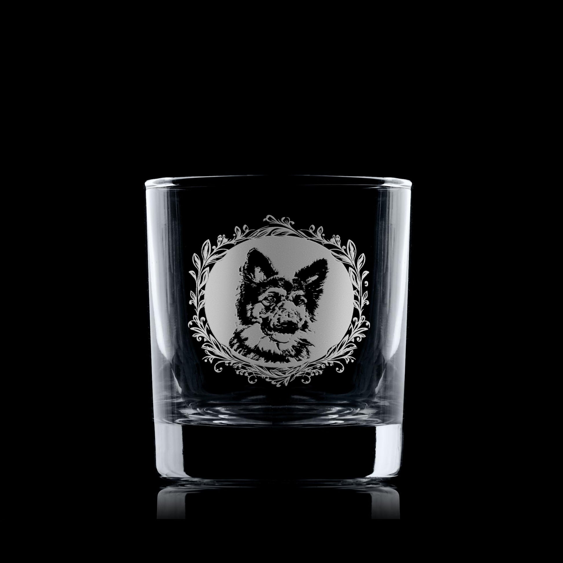 German Shepherd whisky glass displayed on a dark background with a leafy garland portrait design.
