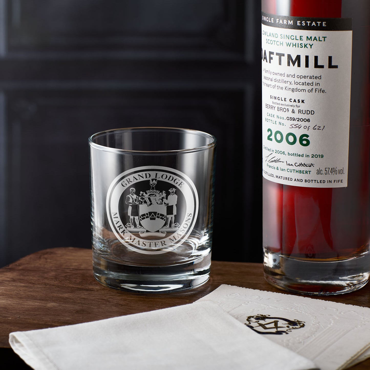 Mark Master Mason whisky glass Engraved Masonic emblem on a wooden surface