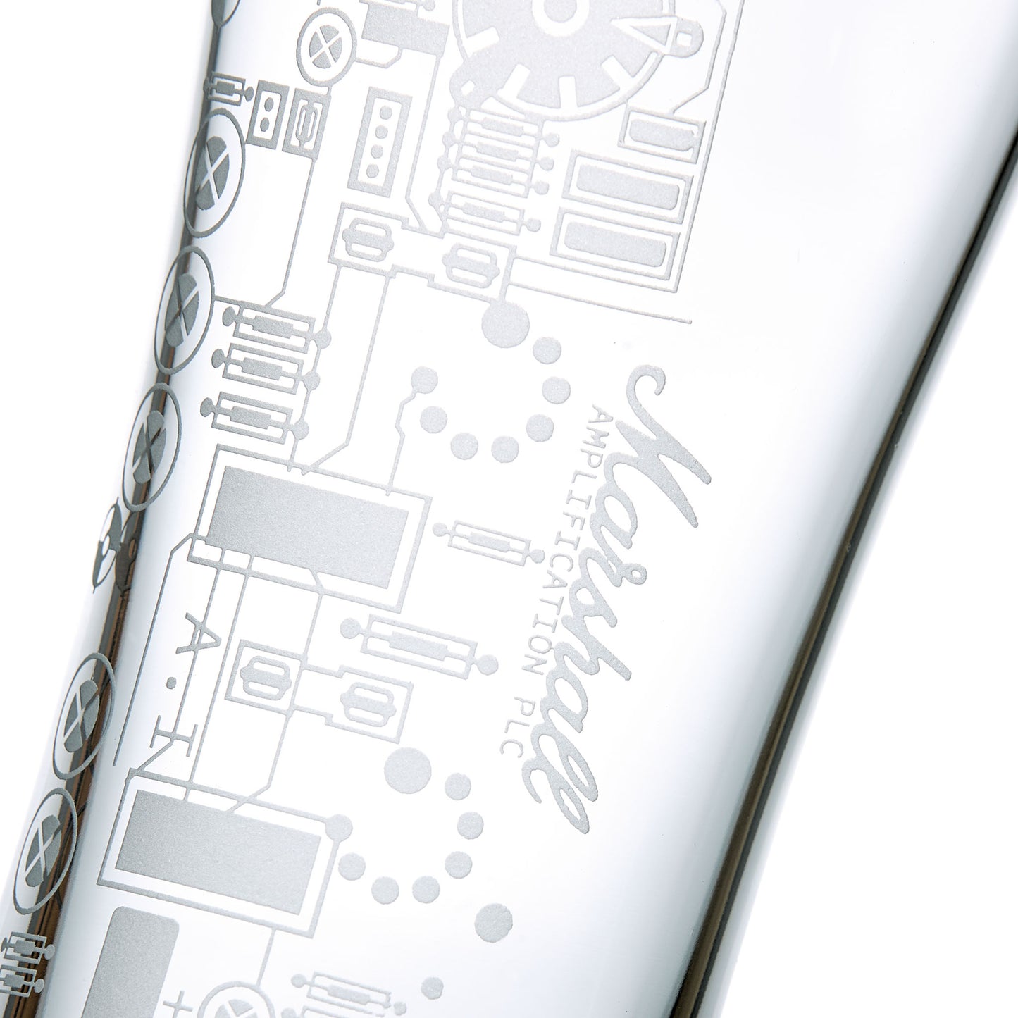 Detail of engraved pint glass featuring a circuit board on a white background