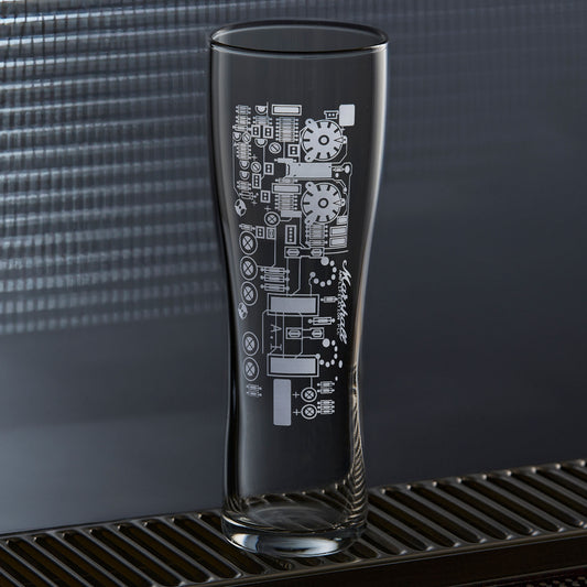 Guitar amp circuit pint glass on a blue background, showing pilsner shape and engraved detail.
