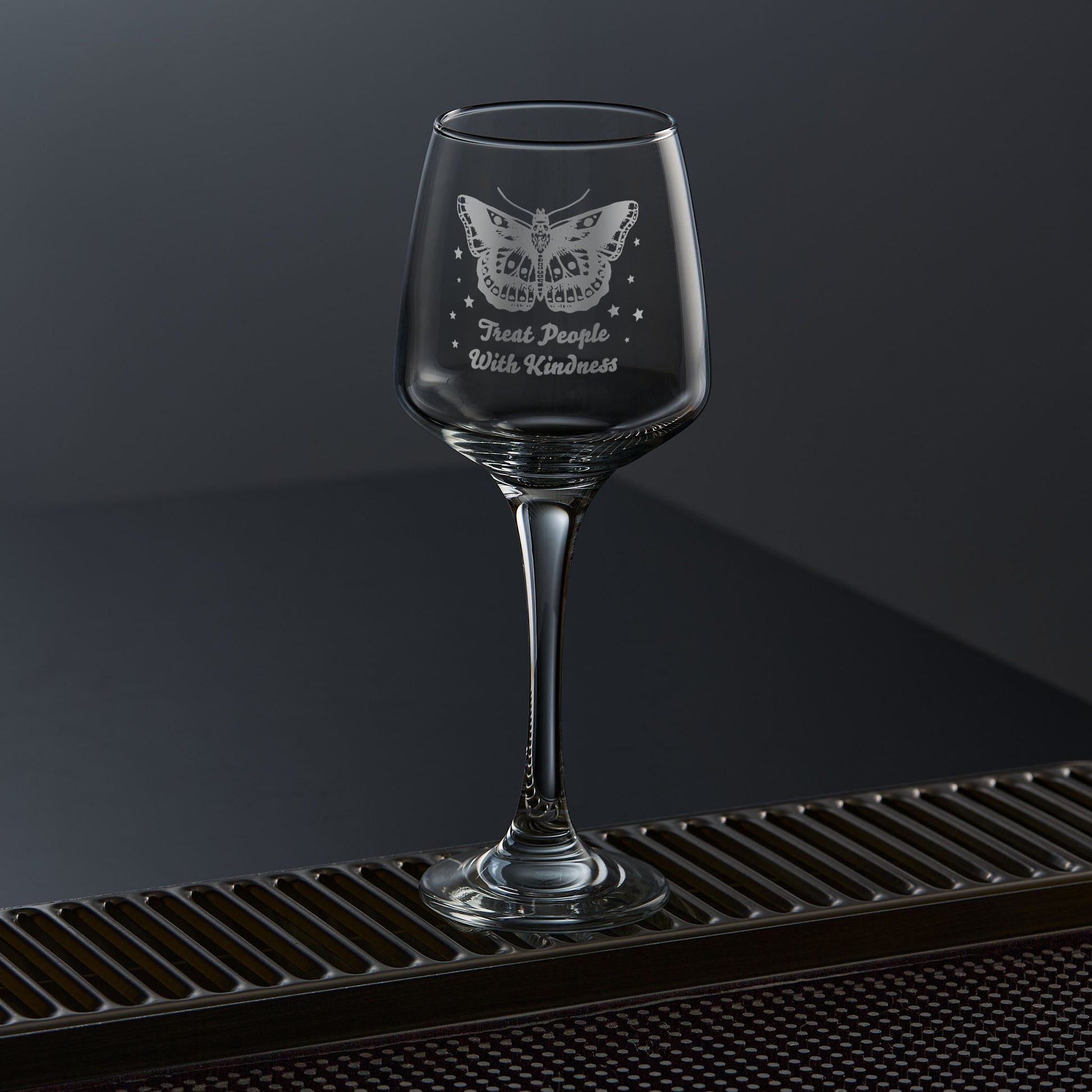 wine glass engraved with styles butterfly tattoo and stars