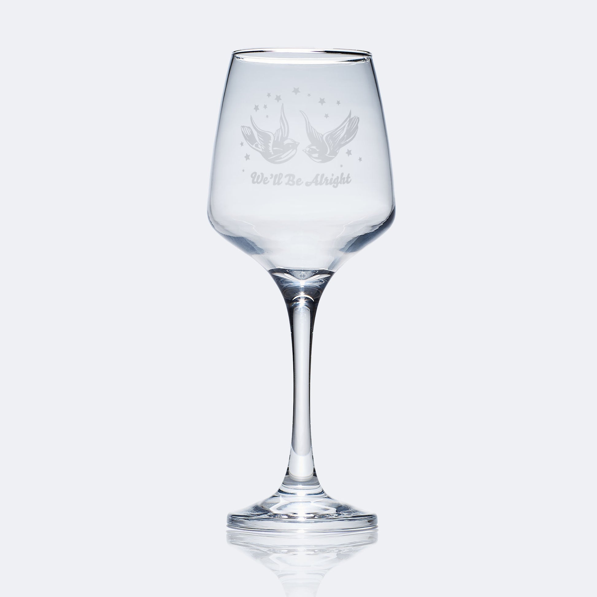 wine glass engraved with styles swallow tattoo and stars