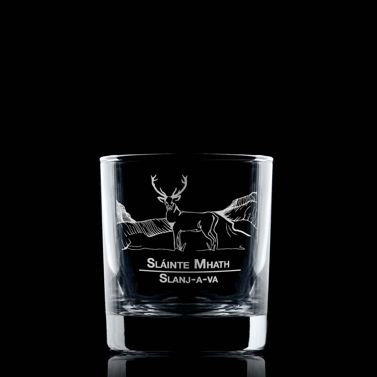 Whisky glass engraved with a Highland Stag and mountain design and featuring the words Slainte Mhath