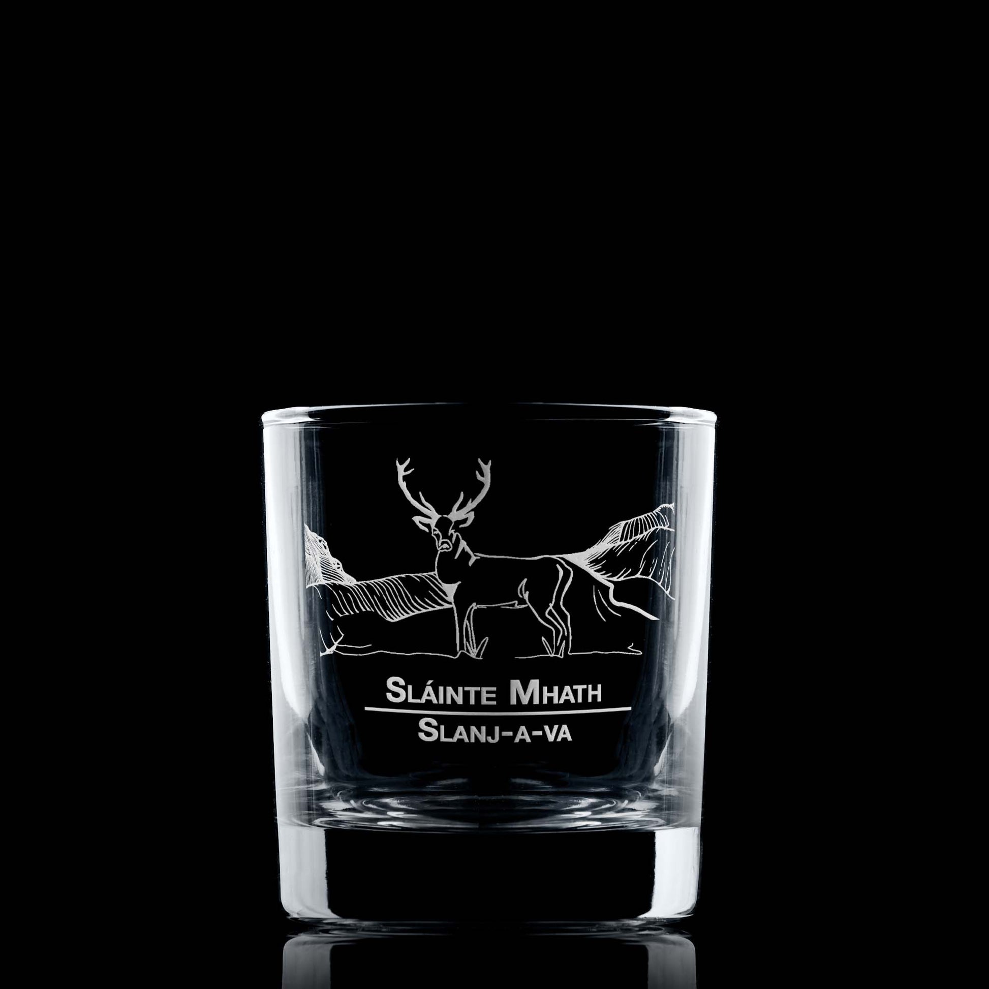 Whisky glass engraved with a Highland Stag and mountain design and featuring the words Slainte Mhath