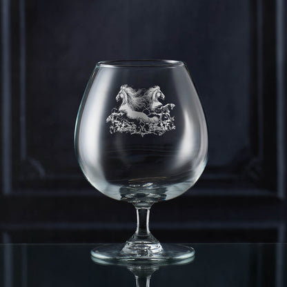 Two galloping horses engraved on a brandy balloon glass
