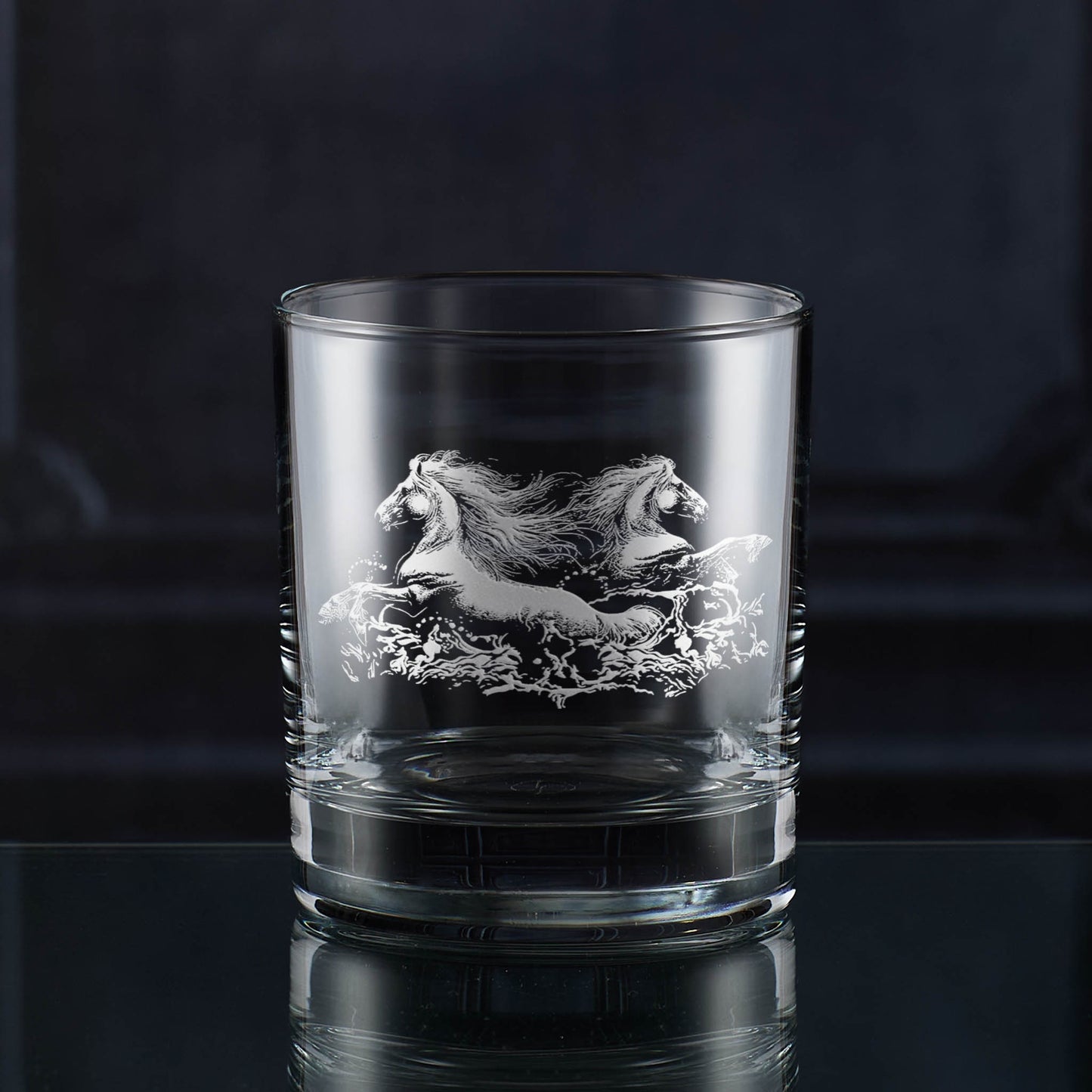 Whisky glass engraved with two wild horses galloping through water