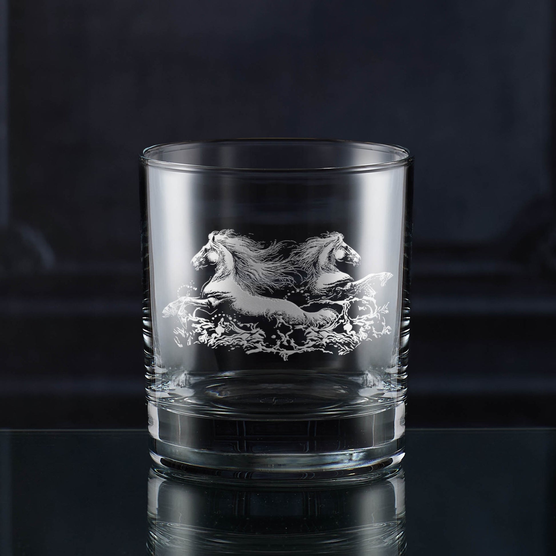 Whisky glass engraved with two wild horses galloping through water