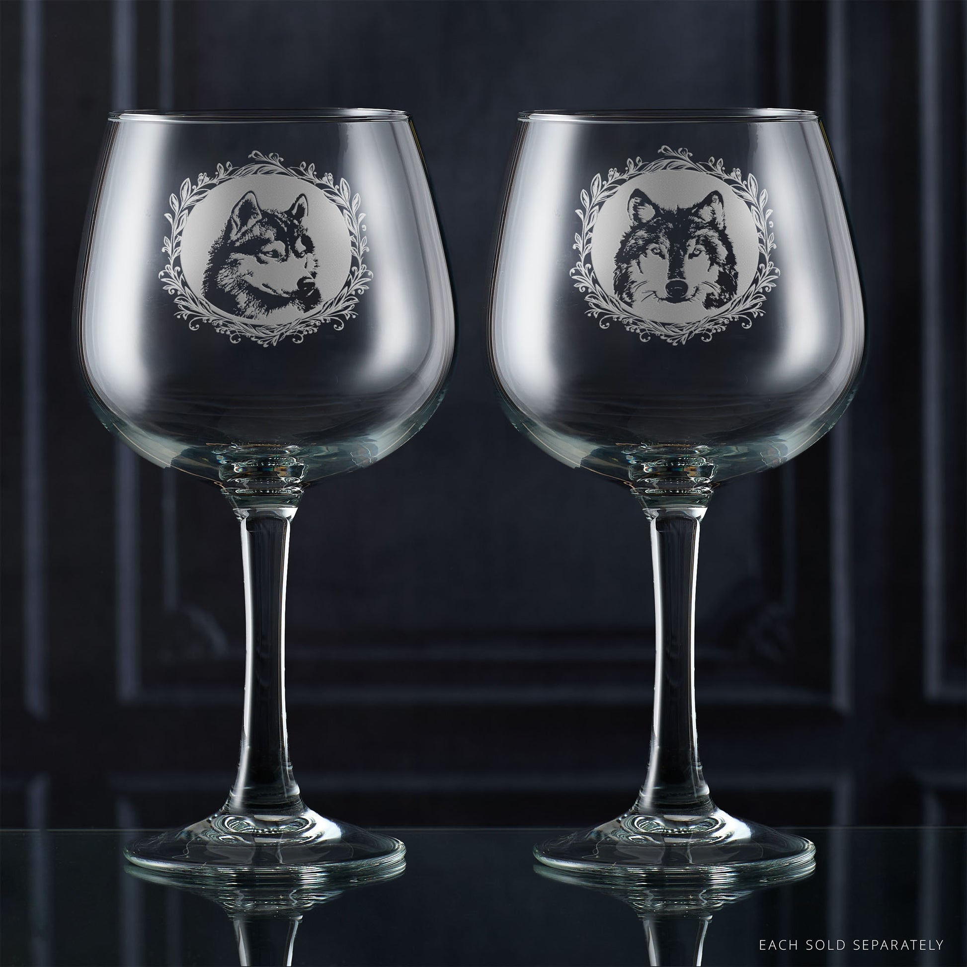 Two gin glasses with engraved husky portrait in circular frame with leafy garland