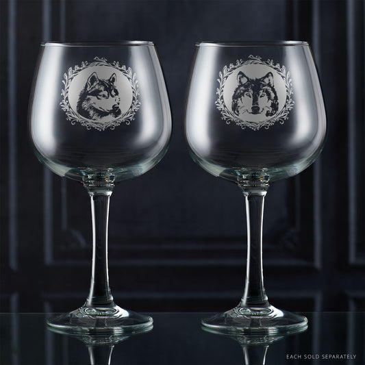 Two gin glasses with engraved husky portrait in circular frame with leafy garland