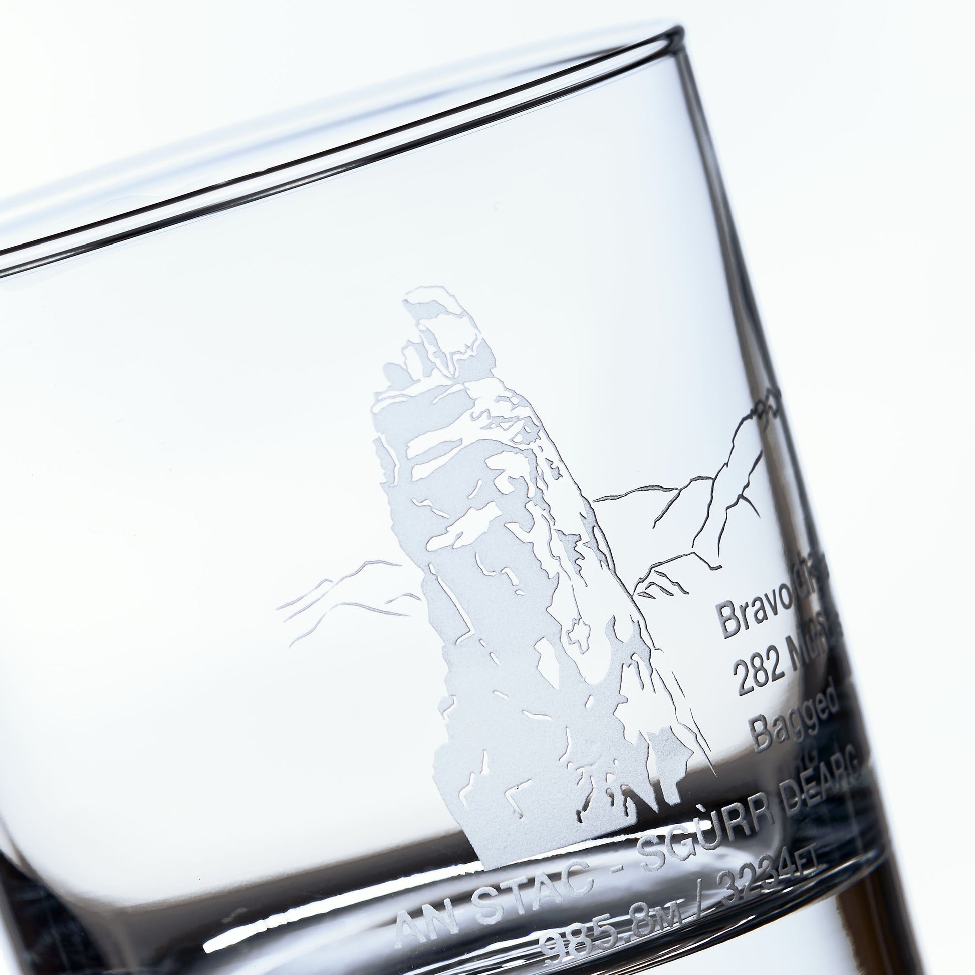 close up detail of sandblast engraving of sgurr dearg cuillin mountain isle of skye on a whisky tumbler