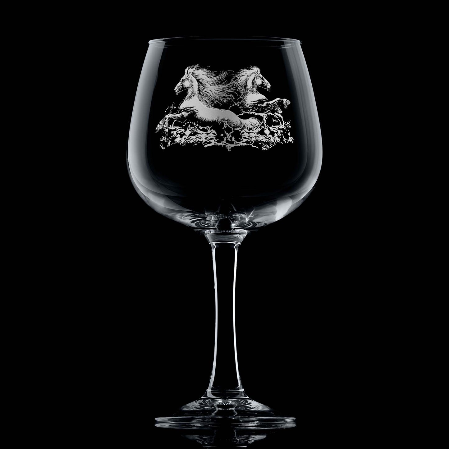 Twin kelpies rising from crashing waves on engraved gin glass with space for a message