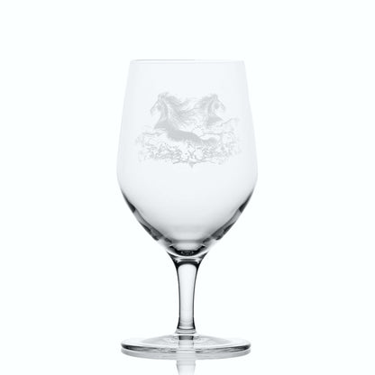 Glass on white background to highlight the shape and form of the glass: Stemmed mineral water glass engraved with Celtic kelpie design