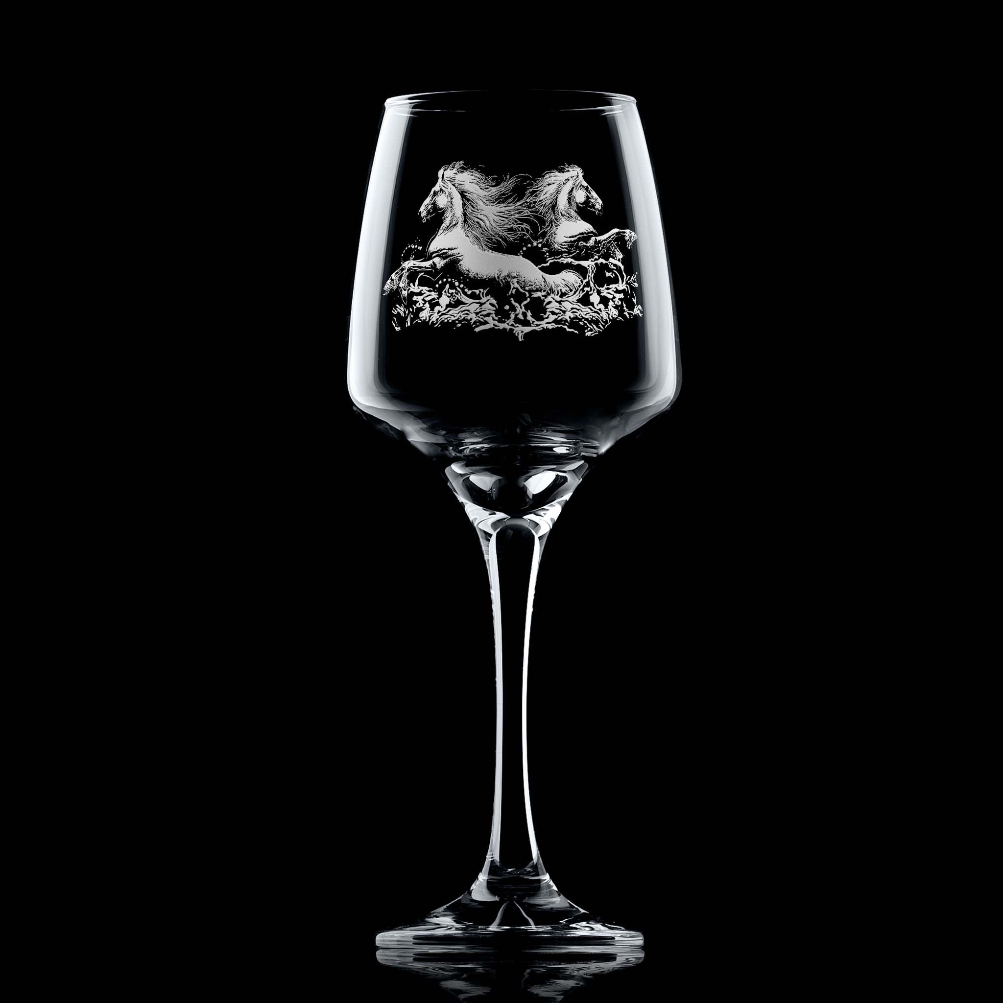 Wine glass engraved with two kelpies (water horses) emerging from the water and space for a personal message below