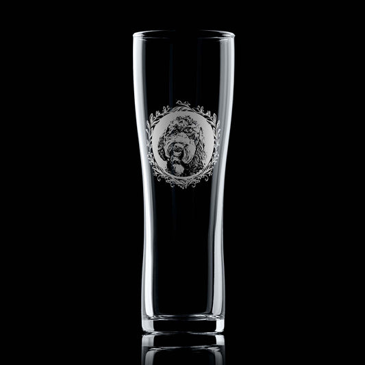 Pint Glass with engraved labradoodle portrait in circular frame with leafy garland