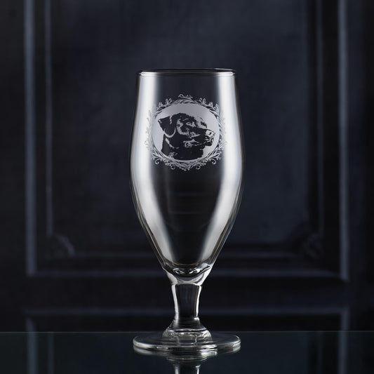 Stemmed IPA glass with engraved personalised design on a dark background