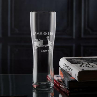 Tall pint glass with Lambretta Li Special scooter design on a dark background