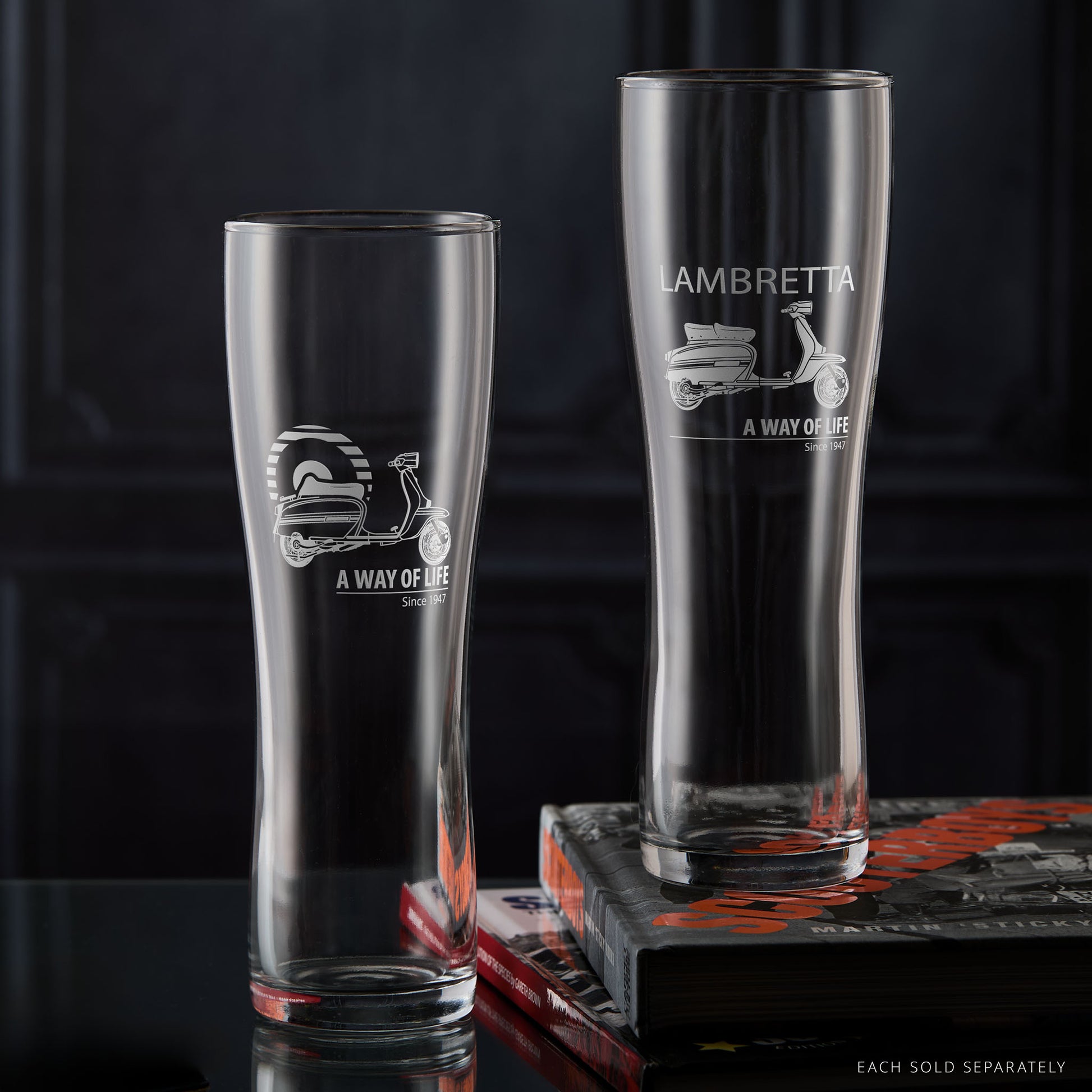 Two Lambretta GP pint glasses side by side showing both Mod Target and Script designs, part of the A Way of Life collection for scooter riders and collectors.