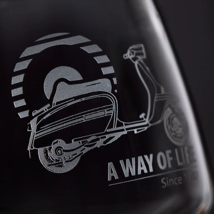 Close-up detail of a Lambretta wine glass showing smooth sandblast engraving