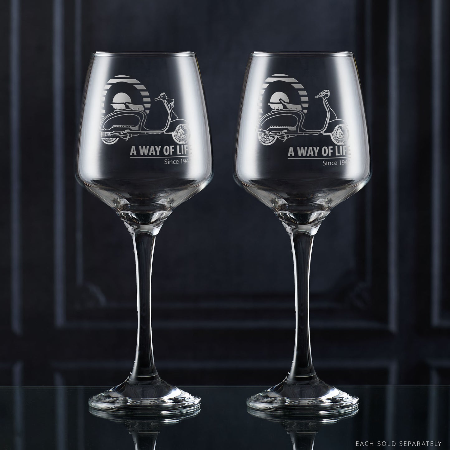 Lambretta LI Series 1 and Series 2 wine glasses engraved with scooters and Mod target, side by side on dark background