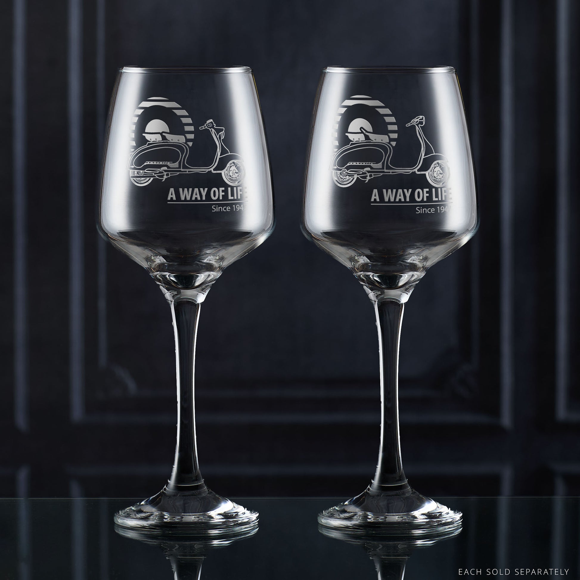Lambretta LI Series 1 and Series 2 wine glasses engraved with scooters and Mod target, side by side on dark background