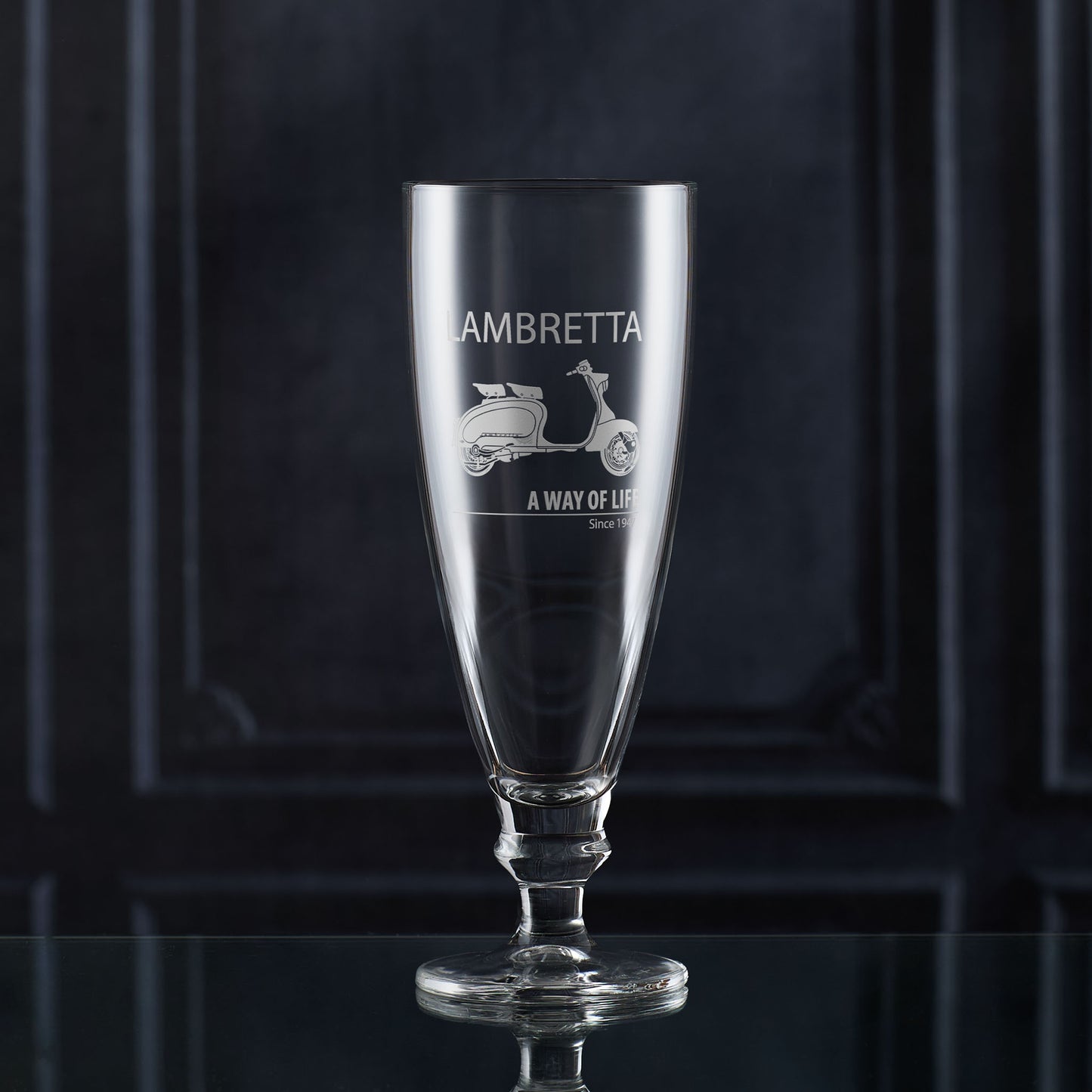 IPA and Craft Beer glass with Lambretta Li scooter engraving on a dark background