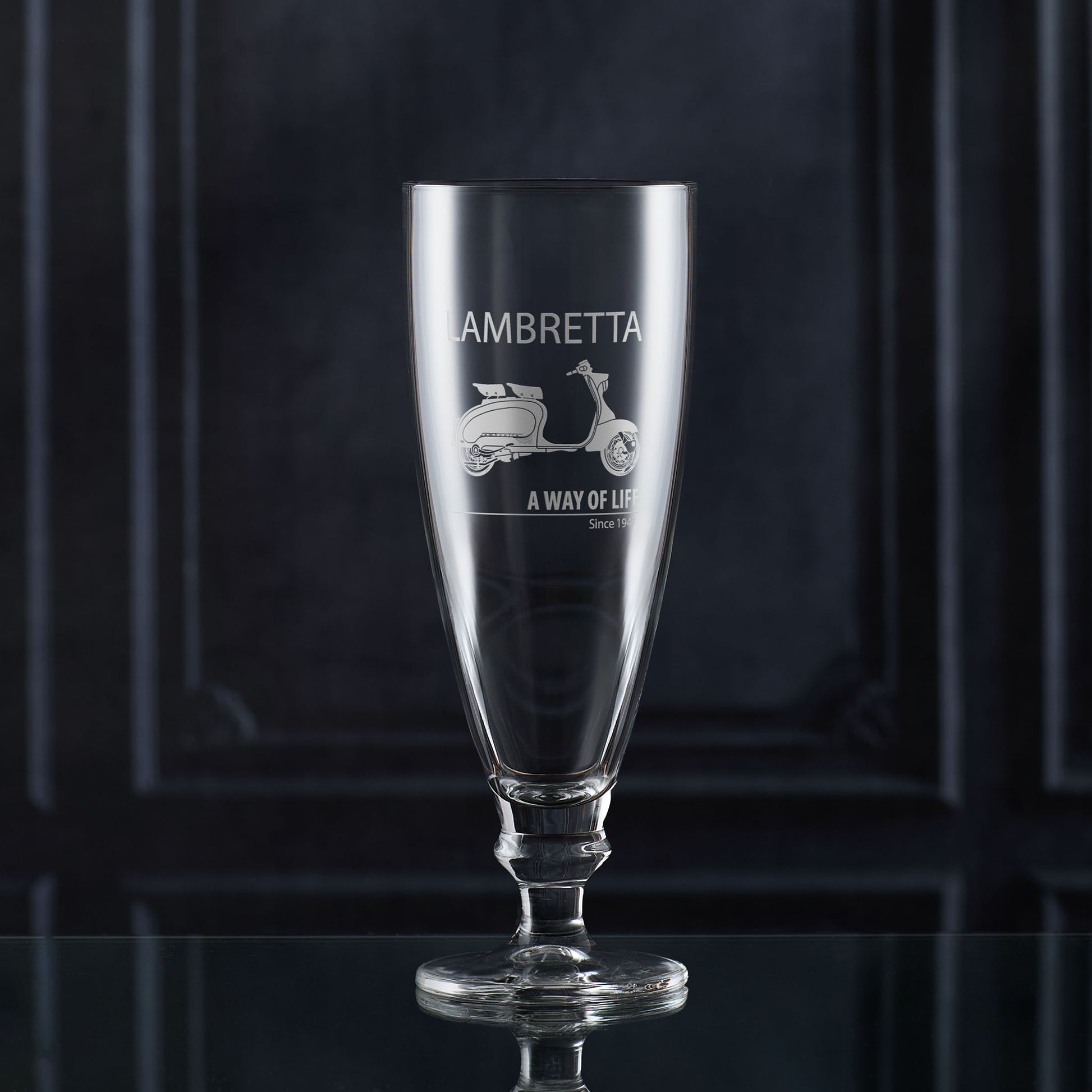 IPA and Craft Beer glass with Lambretta Li scooter engraving on a dark background