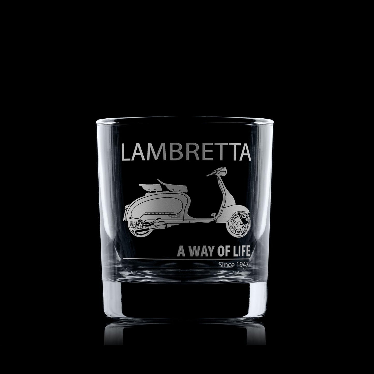 Glass whiskey tumbler with Lambretta Li125 scooter design and text on a black background
