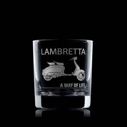 Glass whiskey tumbler with Lambretta Li125 scooter design and text on a black background