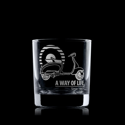 Glass tumbler engraved with vintage scooter design and 'A Way of Life Since 1947' text on a black background