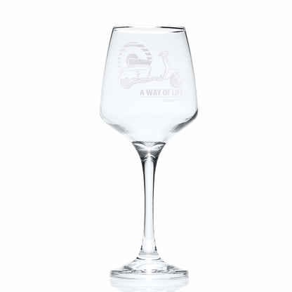 Wine glass engraved with Lambretta SX200 scooter and Mod target, photographed on white background