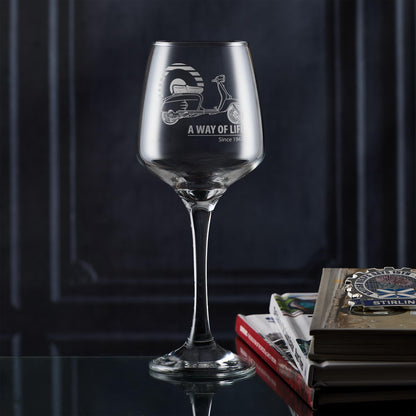 Engraved wine glass featuring SX200 and Mod target, styled in a lifestyle setup with retro detail