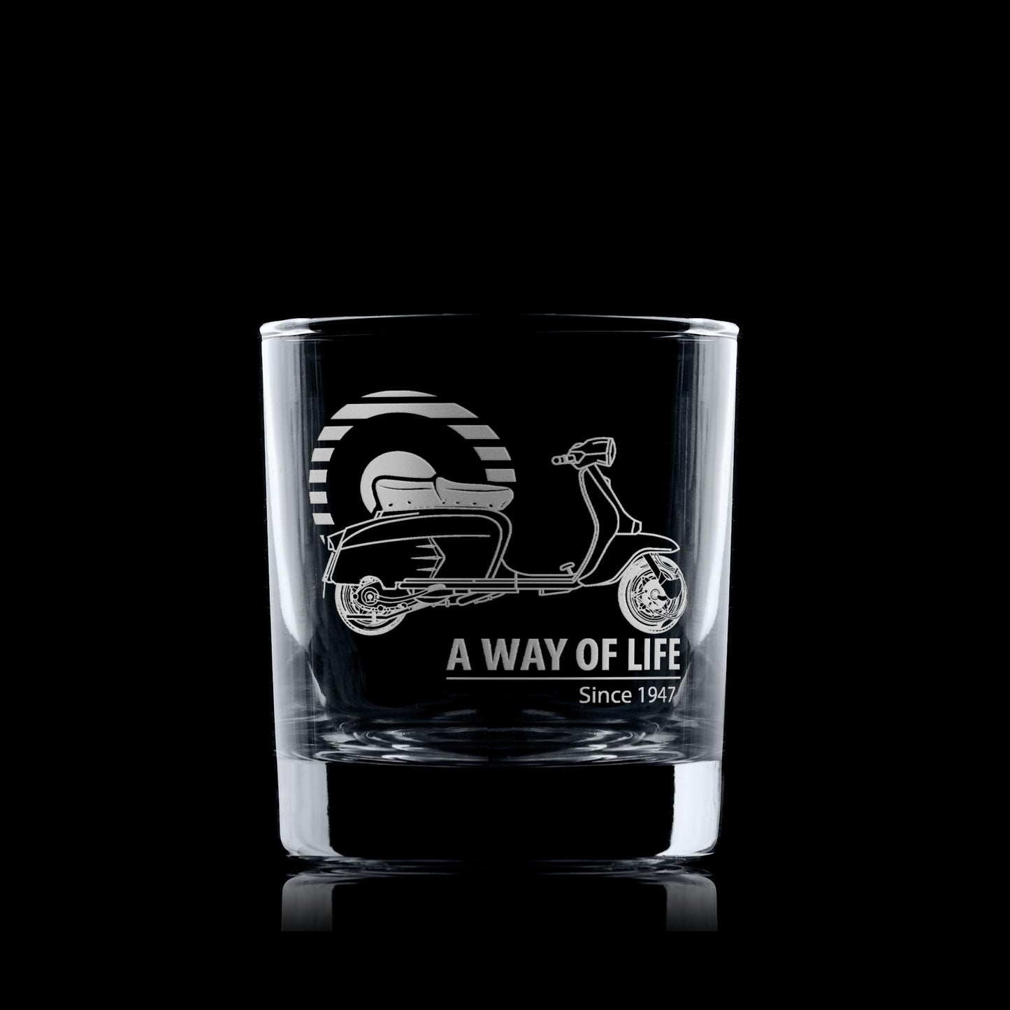 Clear glass tumbler with scooter design and 'A Way of Life Since 1947' text on a black background