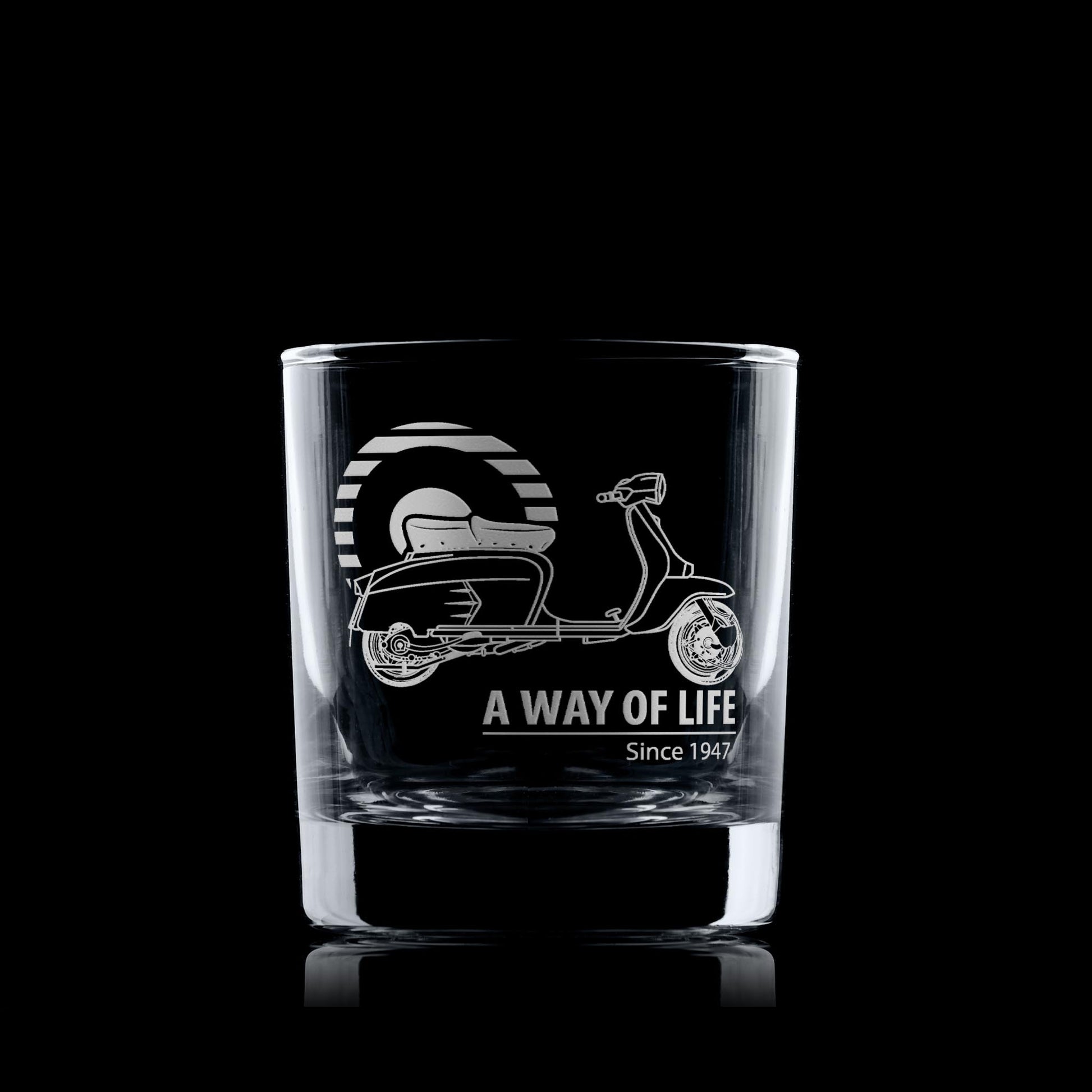 Clear glass tumbler with scooter design and 'A Way of Life Since 1947' text on a black background