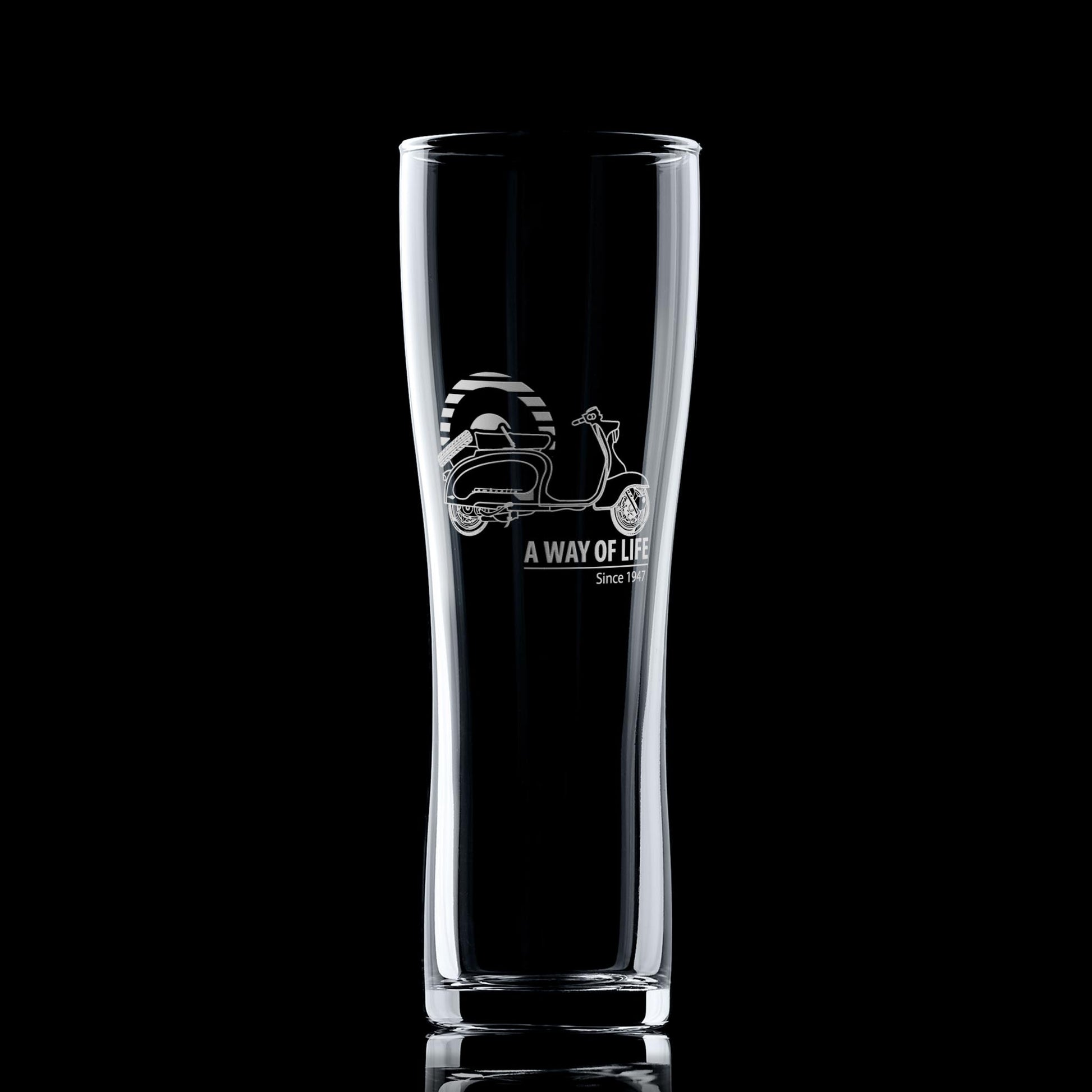 Engraved TV175 pint glass with striped Mod target, shown on dark background
