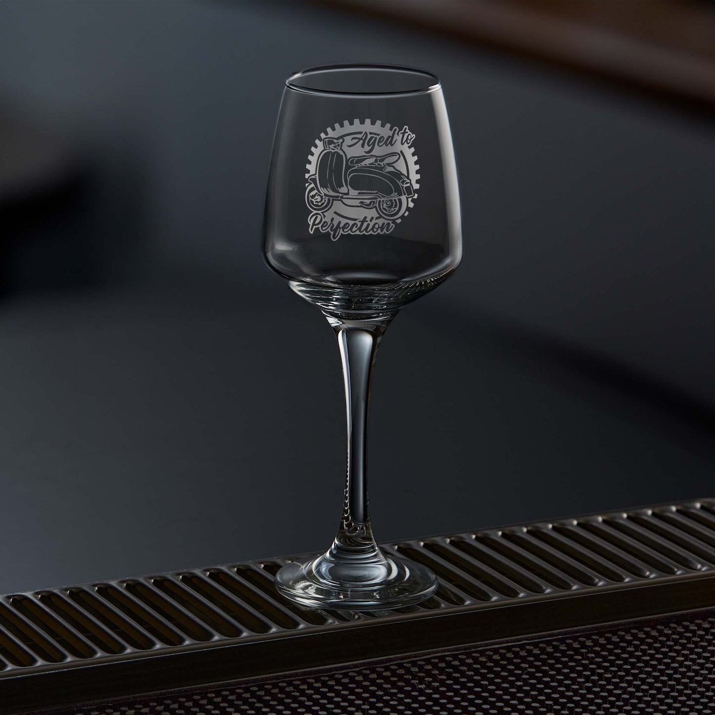 Engraved wine glass etched with a lambretta li125 scooter