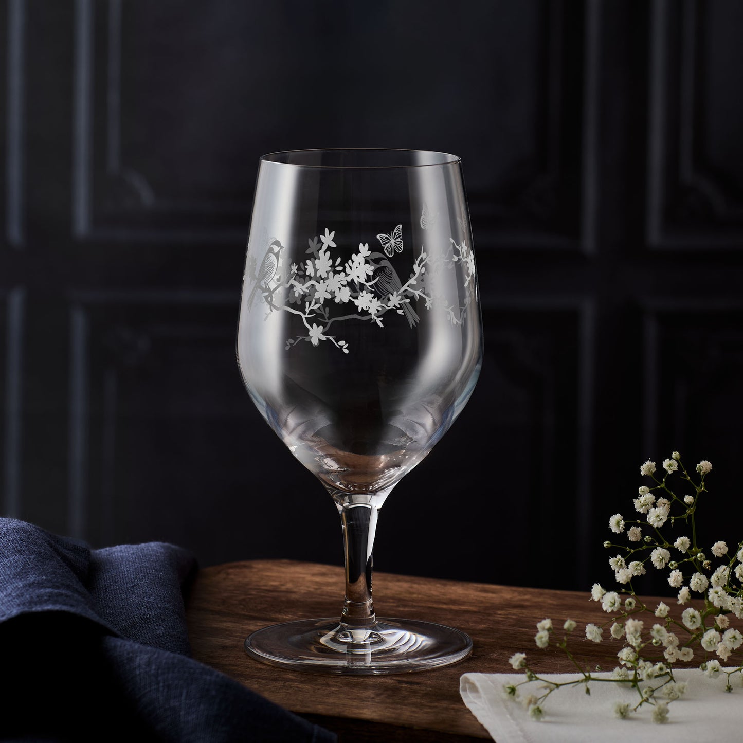 Gardeners stemmed water glass engraved with birds, butterflies, and flowers – handcrafted and elegant
