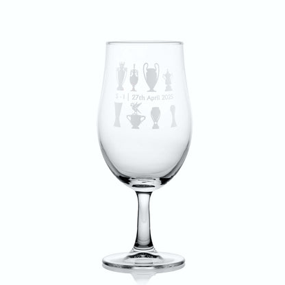 Chalice-style beer glass shown with personalised match score, the liverbird and championship trophies